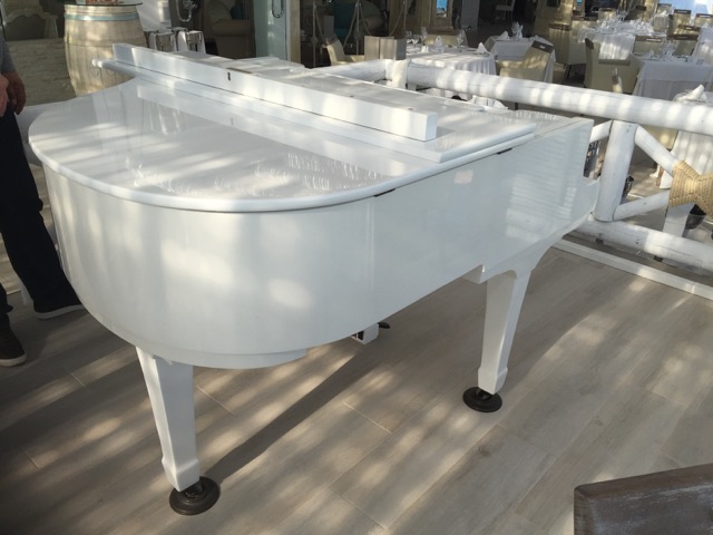We can now hire you a highly polished white mini grand dummy piano.