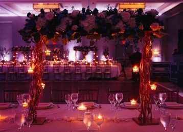 beautiful-pink-decorated-wedding-serving-with-centerpiece-lightening-candles